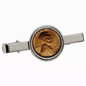 Always in fashion since the 1920s, tie clips are used to secure the tie to the dress shirt. Rest assured your tie will not be blowing in the wind our a coin tie clip. The 1909 "First-Year-of-Issue" Lincoln Wheat-Ear Penny is now well over 100 years old! The Lincoln Wheat-Ear Penny is the first U.S. minted coin to honor an American President. The silver tone 2 1/8 inch long tie clip featuring a genuine United States coin maintains a sleek yet elegant focus to any attire. The coin silver tone clip