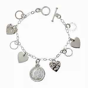 A genuine United States Silver Dime is the focus of this Sterling Silver Heart Charm Toggle Bracelets. Four heart and four circle charms surround the silver dime and hang from a 7 1/2 inch open link chain Bracelets. Adorned with a genuine Seated Liberty Dime, struck of .900 fine Silver from 1837-1891. The Seated Liberty Dime was designed by Christian Gobrecht. The toggle clasp makes it easy to put on and take off by yourself. A Certificate of Authenticity is included.
