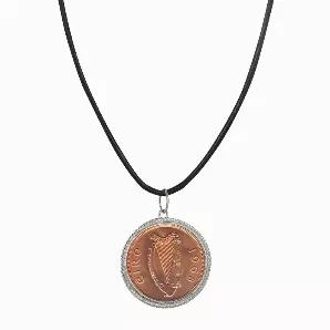 The large Irish penny lends a two tone look to this coin necklace. A genuine Irish 1 penny is set in a sterling silver rope bezel and hangs from a leather cord 18 inch necklace with a 2 inch extender and lobster claw clasp. The penny was minted from 1928 to 1968 and is composed of bronze. A Certificate of Authenticity is included. Coin years will vary.