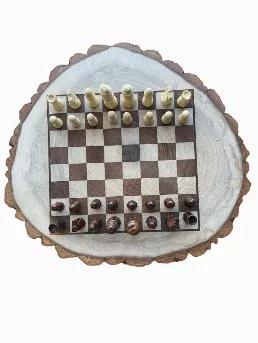 Wood Slice Chess/Checkers Board. Hand Crafted by us here in the Mountains of Western Maine, just on the Canadian Border. <br data-mce-fragment="1">Kiln Dried Slice is finished smooth with a Natural Linseed oil Finish.<br data-mce-fragment="1"><br data-mce-fragment="1">Wood Slice is approx 14"-16" Diameter x 1 1/4"-1 1/2" Thick<br data-mce-fragment="1"><br data-mce-fragment="1">Chess and Checker pieces Storage Pouch included 