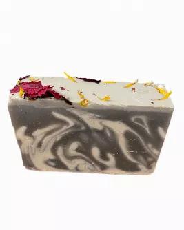 Enjoy this detoxifying blend of kaolin clay activated charcoal soap bar. Because guys like to pamper themselves too. Topped with dry roses, calendula and other flowers. <br> Ingredients: kaolin clay, activated charcoal, olive oil, coconut oil, soybean oil, agua de gio oils, water, sodium hydroxide, dry flowers<br> Net weight 4