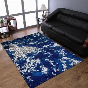 Makeover your home flooring with this hand knotted silk rug which is the epitome of rich look in the shades of blue and beige color. Though the abstract pattern of this rug appears modern but it gels well with the conventional home interiors as well. This rug is designed in the perfect dimensions to adorn your home gracefully.