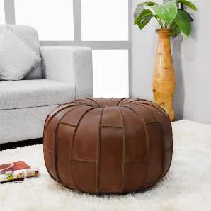 A pouf is a versatile and comfortable furniture piece with multiple functions ranging from seating to being a foot rest, or even a side table. This solid handmade buffalo leather round pouf Is made up of recycled foam with fibre filled. Available in brown colour and 14x14x14 dimensions.