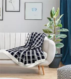This contemporary style throw is sure to add elegance to any space.
