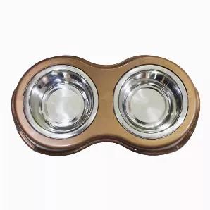 Double Diner pet bowl makes it easy to feed your pet in an organized way. The antique gold plastic frame holds two stainless steel bowls that can be used for food, water or a combination of both for your pet. It does not occupy much space and each bowl has a weight capacity of 350 ml. This double diner is supported by rubber protectors that makes it skid proof.