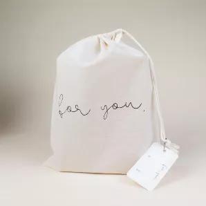 <p>Wrap up something special for someone that you love any time of year with our reusable gift bags. </p>
<p>These 10"x13" GOTS certified organic cotton bags are designed to inspire intentional gift giving. Handmade and screen printed in Kelowna</p>
<p>This collection of reusable bags was designed to used year round for birthday's, holiday's and any other time you need to wrap up a sweet gift. <meta charset="utf-8"><span data-mce-fragment="1">Complete with a simple hang tag with space for you to