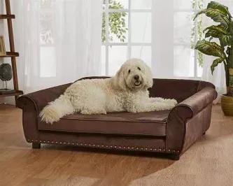 Cooper, a 44 pound Golden Doodle sits proudly on the Outlaw Sofa, which lives up to its name, being the biggest pet sofa in all the land! It's perfect for the largest of dogs to lounge in total comfort. It is fully upholstered in Ultra-Plush and pebble-grain, faux-leather trim with brass nailheads. The Outlaw is made with durable wood-frame construction, low profile arms and a high loft, milled, memory foam cushion, so our grandest sized pets are offered some relief to aging and aching joints.<u