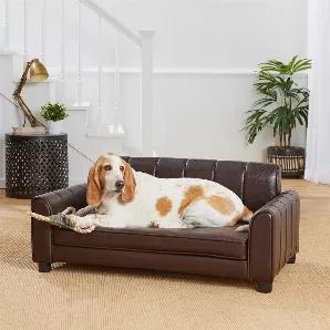 Hampton, a 58 pound Basset Hound looks settled in on this handsome new Ludlow Sofa. The high quality, pebble-grain faux-leather is easy to wipe clean. Its channel tufted style with generous, wide, cushioned arms offers a place for him to lean or curl up comfortably. Constructed with durable, furniture grade construction. The Ludlow is perfect for pets up to 60 pounds.<ul><li>2" legs lift bed off floor, keeping your pet draft free</li><li>Perfect for pets who like to curl or lean when they sleep<