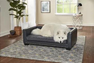 Meet Laylani, a beautiful 60 pound Samoyed, resting on the Chaz Sofa. The clean lines and contrasting grey velvet with grey pebble-grain faux-leather and silver nail-head detail, offer a modern touch with a sturdy feel. The low profile arms and back provide a perfect place for your pet to lean while resting. The seat cushion cover is removable and washable.<br>2" legs lift bed off floor, keeping your pet draft free<br>Perfect for pets who like to lean, stretch or curl when they sleep<br>Removabl