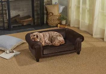 The Chester Sofa, with Chloe the 22 pound Cock-a-Poo looking so cute, is a luxurious, dark brown velvet pet sofa accented with brown pebble grain, faux-leather trim on the seat cushion, as well as stylish biscuit tufting. It features classic style, comfy, rolled arms and back, perfect for leaning. Fully upholstered with high quality furniture grade construction.<br>2" legs lift bed off floor, keeping your pet draft free<br>Perfect for pets who like to lean or curl when they sleep<br>Easy to spot