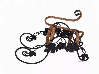 <p>Elevate any table arrangement with the On the Vine Embellished Metal Carriage Wine Holder, finely handcrafted from metal and adorned with rattan. Intricate metalwork gives a realistic impression of grapes on the vine. At 13.78 x 6.3 x 9.84 inches, it is ideally sized to carry most bottles of wine.</p>