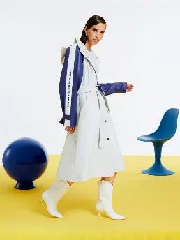 <p>Oversized trench coat with self-belt, hood and epaulettes on shoulders. Long sleeves with text detail. Front snap button closure and side pockets.</p>
<p>Social Message: Comfy and playful touches carry over from our virtual profiles on digital screens into our lives. Stay in the flow! Comfy, timeless cuts coupled with bright colors full of vibrating energy make up this collection that marries the digital with the real.</p>
<p>Torso: 100% Pu Coated Cotton Trimming: 98% Cotton 2% Pa Coated Elas