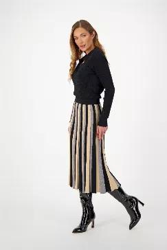 <p>This show stopping knit skirt is crafted from a stretchy viscose blend. This skirt is bold and easy to wear, with a blend of timeless colors: camel, black and grey you can pair it back to so many things. Easily take for travel and style with tanks and tees, and carry through to fall pairing with sweaters and our ribbed Polo top! Elastic waist finish, with knitted pleats.</p><p>Model wears a size small. Model: Waist: 25", Hip: 36"</p><p>True to size, fabric has stretch.</p>