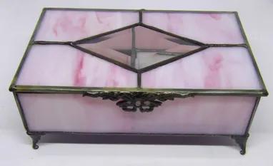 <p>This large jewelry box is great for holding and organizing your special jewelry. Stained glass basic jewelry box with black patina finish. Large clear glass diamond bevel insert on lid. Inside is partitioned into 3 compartments and lined with black felt and ring holder. </p><div><div><ul><li><span>Black patina finish.</span></li><li><span>Approximately 5 wide x 8 long x 3 high with feet.</span></li><li>Due to the nature of stained glass color and characteristics may not be as pictured.<br></l