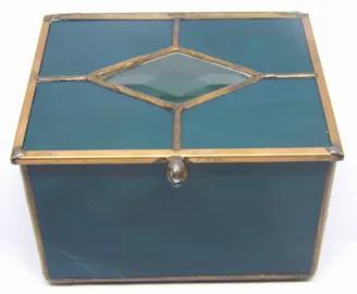 <div><div><span>This stained glass trinket box is great to keep your special treasures. Stained glass basic trinket box with copper patina finish. Small clear glass bevel insert on lid. </span></div></div><div><div><div><div><ul><li><span>Copper patina finish.</span></li><li><span>Approximately 4 wide x 5 long x 3.5 high with feet.</span></li><li>Due to the nature of stained glass color and characteristics may not be as pictured.<br></li><li><span>Please allow one week for us to handcraft your i