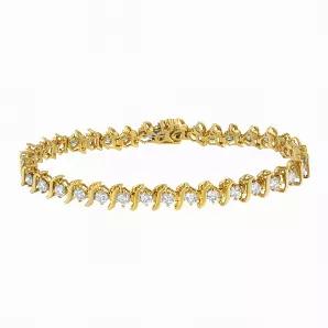 A stunning link bracelet that glistens with round diamonds set within S-shape links to add a timeless touch to this design. Crafted in 2 micron 14 karat yellow gold plated sterling silver, this bracelet elegantly puts the finishing touch on an outfit. It has a total diamond weight of 5 carats.