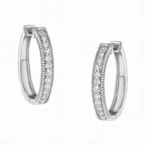 A pair of modern diamond hoop earrings that feature a row of round diamonds. Crafted in 10 karat white gold, they have a total diamond weight of 1 carat.