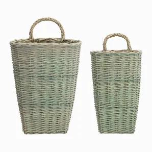Adorn your walls with this beautiful set of Wicker Wall Baskets. Featuring two assorted sizes, the eclectic green finish paired with the woven wicker design is the perfect combination to create a timeless display. The quality wicker composition is sure to last for seasons to come. Complete the look by adding a bunch of dried florals or faux floral arrangement to each basket.