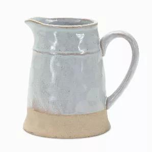Enhance your home Decor with this beautiful Porcelain Pitcher. The neutral tan and grey tones paired with the half-glazed finish is the perfect combination to create a stunning display. The quality porcelain composition is sure to last for seasons to come. Complete the look by adding a bunch of dried florals or fresh garden stems to the vase.
