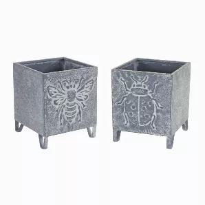 Welcome the spring season with this adorable set of Insect Planters. Featuring two assorted sizes, the insect designs include bumble bee and lady bug. The traditional white and grey tones paired with the weathered finish is the perfect combination to create a timeless spring display. The quality iron metal composition is sure to last for seasons to come. Complete the look by adding a potted plan or floral arrangement to each pot.
