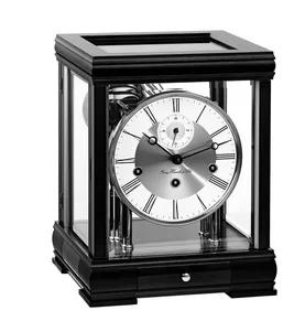 Sophistication at its best. This classic in the Hermle collection is elegant and timeless made of precious mahogany, walnut or cherry wood. The glass sides offer a fascinating look at the Westminster chiming bell strike movement. Complete with a second hand and Automatic night shut off this mantel clock has it all.