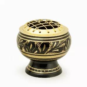 A beautiful brass incense burner in black and gold colors comes with a removable net. Can be used for various types of smudges and incense. In addition to spreading a pleasant aroma, its beauty will add a special quality to your space. Comes with a wooden coaster. <br data-mce-fragment="1"><br data-mce-fragment="1"><br data-mce-fragment="1">Ideal for creating a special atmosphere in your meditation room, using it on your altar, decorating a living room, carrying with you on a trip, and even plac