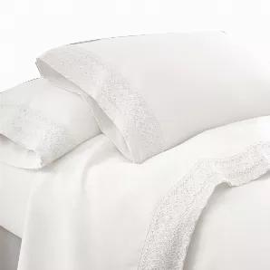 Accentuate your bedroom with sheer relaxation by adorning your bed with this 4 piece queen size sheet set which includes 1 flat sheet, 1 fitted sheet and 2 pillowcases. Crafted from white microfiber polyester, it features reinforced seams that makes it last long while the 5 inch lace trim on flat sheet and pillowcases adds to its look. This sheet set is machine washable and finely designed using high thread count which offers a luxurious comfort.