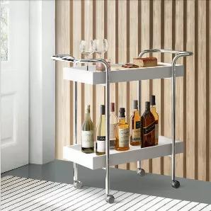 Add wheels to your scrumptious snacks and drinks with the introduction of this versatile Storage Cart. Incorporated with two tier storage facility, it is supported on casters for mobility. Constructed sturdily from the CARB certified wood product to ensure a stable equilibrium with nature and health, the tubular metal frame is an add on to its sturdiness. The glossy white accented top is complemented with a chrome coated metal frame, adding an enchanting visual flair. Be it a convivial gathering