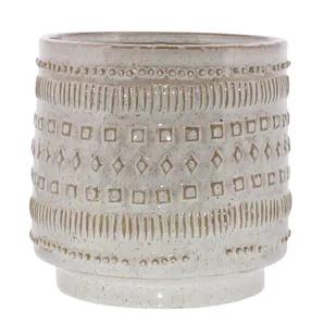 Add a bold statement and dimension to your home, garden, or patio with this cachepot. It is crafted from ceramic in a white finish with a embossed geometric pattern that adds a minimalist touch which gives modernity to space. It can be displayed with your favorite little plants and succulents indoors on a desk or shelf, or outdoors on a porch or patio.