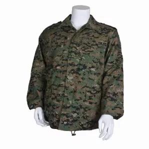 M65 Field Jacket With Liner - Digital Woodland.     65% polyester / 35% cotton water repellent shell<br>
Deluxe 100% polyester, fiberfill button-in liner (not shown)<br>
Heavy duty #10 zipper w/ rugged fabric matching pull cord<br>
Full snap-down storm flap over zipper to protect from external elements<br>
2 bellowed chest pockets & 2 lower waist pockets w/ snap down closure<br>
Shoulder epaulets<br>
Adjustable hook & loop cuffs<br>
Brass-zippered concealed hood (not shown)<br>
Gusseted upper ba
