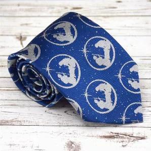 This tie is the perfect accessory for the Christmas season!  The beautiful blue tie has an image of Mary and Joseph with the baby Jesus.  Tie is approximately 58"? and made from woven microfiber, which is washable and more durable than silk.