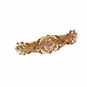 <p>Royal jeweled automatic barrette with Swarovski crystals. 78 bronze and smoke rhinestones in various shapes, sizes, and cuts.</p>    <br><tr><th>Material:</th><td>Rhinestone</td></tr><br><tr><th>Manufacturer:</th><td>Asia</td></tr><br><tr><th>Hand made plastic:</th><td>No</td></tr><br><tr><th>Hand painted:</th><td>No</td></tr> <tr><th>Style:</th><td>Day/Evening</td></tr>  <tr><th>Size:</th> <td>Large</td></tr> <tr><th>Width (Inches):</th> <td>3.75</td></tr> <tr><th>Style #:</th> <td>1525</td>