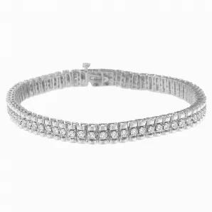 Lend a perfecarat balance of sophistication and shine to your gorgeous look with this tennis diamond bracelet. The beautiful piece of jewel is made using high-quality sterling silver and embellished with flickering round cut diamonds. Polished high to shine, all the diamonds are arranged in a prong setting. This elegant bracelet comes with a box clasp lock, which makes it get fit on your wrist perfecaratly.