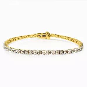 This tennis bracelet has a classic and timeless design. Fashioned in 14k yellow gold plated sterling silver, this design features 5carat Total Diamond Weight of glimmering round cut diamonds. 55 prong set diamonds make up this piece that secures with a box with clasp mechanism.
