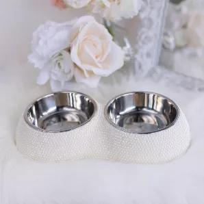 Give your pooch a fine dining experience with our crystal bowls by Hello Doggie. The base of the bowls are adorned with crystals and feature two removable stainless steel bowls. The stainless steel bowls are dishwasher safe and the base is recommended to be hand washed. Perfect for small dog.