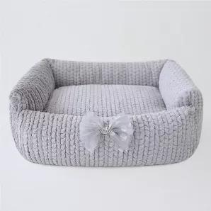 Hello Doggie is excited to debut our new bed collection. The Dolce bed is made with luxurious, soft-cuddle fabric stuffed with 100% poly-fiber fill. The bed has a removable pillow and a non-slip floor to keep the bed safely in place. A removable decorative bow is featured on the front. Available in four beautiful colors this bed collection is perfect for cuddle time. It is easy to care for machine wash on a gentle cycle, no bleach or fabric softener, dry on low heat or air dry for brand new look