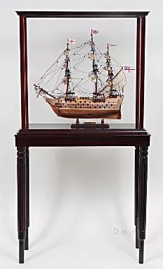 This beautiful display case was made out of hard wood and painted in dark mahogany color. It has plexiglass panels on all sides. It is a perfect display case for small tall ships from 19"-22" such as T175 HMS Victory Small, T147 San Felipe Small, and T014 Cutty Sark Small. This case is very effective when it comes to preventing dust particles as well as keeping your valuable ship model looking new and protected at all time. It is a must have for model ship enthusiasts or passionate collectors. M