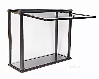 This beautiful display case was made out of hard wood and painted in dark mahogany color. It has distinctive designs that add elegance and beauty when displayed in your home or office. It is 100% fully assembled and comes with plexiglass panels on all sides. It features an easy access door or panel to move your ship in and out from the display case. It is used to display all mid-size tall ship 28" such as HMS Victory Mid-size and USS Constitution Mid-size. This case is very effective when it com