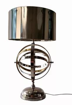 Accent any room with this gorgeous aluminum armillary style table lamp. The armillary sphere has been around for centuries and represents the lines of celestial longitude and latitude. Every daydreaming aviator needs an armillary sphere in their home to help map the stars. The silver and gold armillary rings can rotate at the sides while holding the lampshade from up top. It comes with a plug-in cable that has an on/off switch for easy operation. The light bulb is not included and sold separatel