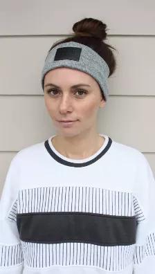 Ultra soft cashmere knit ear warmer headband with Black leather label and fleece interior. One Size Fits All, Unisex.
