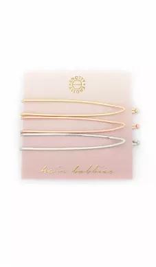 Open pointed shape hair bobbies 3-pack packaged on a card. approximately 3" across.