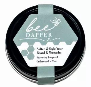 Bee Dapper is perfect to soften & style your beard  & mustache.  This handcrafted balm shapes, molds, and conditions. Bee Dapper is made with beeswax, vitamin E, aloe vera, and seven essential oils that smell rugged and handsome.  And let's be honest... Every woman loves it too! Who wants to snuggle a bristly beard? Rub a small amount of Bee Dapper into your hands until soft, and then into your beard for perfect results. 
