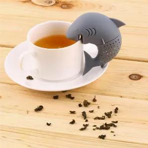 <p>Tea steeper | Silicone Tea infuser | Gag gift| &nbsp;Shark design | Assorted colors | Holds loose tea | Ideal gift for tea lovers<br /> Silicone Tea Infuser Gag Gift Assorted colors Shark Design<br /> Strainer Holds loose Tea&nbsp;<br /> Made of food-grade silicone that does not affect the taste of your tea. Odorless. &nbsp;<br /> Make tea preparation easy.&nbsp;<br /> Microwave and dishwasher safe.<br /> Funny &nbsp;Gift</p>