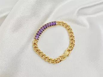 Our Thea bracelet will make any outfit instantly more stylish than before. Beautiful purple zircon gems at the front of a polished 18K gold chain. Adjusts to fit most wrists.<br data-mce-fragment="1"><br data-mce-fragment="1"><br data-mce-fragment="1"><br data-mce-fragment="1"><br data-mce-fragment="1"><br data-mce-fragment="1">
<ul>
<li>Weight: 12.5g</li>
<li>Length: 18 cm</li>
<li>Material: Stainless steel + 18k gold + zircon</li>
</ul>
<br data-mce-fragment="1"><br data-mce-fragment="1"><br d