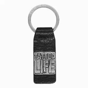 Rep the TATTED LIFE with this genuine leather keychain. Keychain made for the tattoo lovers out there features a black leather strap, which hangs off a stainless steel ring with our Controse logo inscribed on it, and on the strap sits a stainless steel plate with the words TATTED LIFE etched on it.316L Stainless Steel with black leatherPouch included Product Dimensions: 3 x 0.86 x 0.2 inches