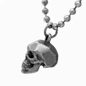 Be an absolute badass with the Steel Skull Beaded necklace. Made of stainless steel, the skull pendant on the Steel Skull Beaded necklace is covered in IP black with a used look. Complete with a stainless steel, beaded chain with a used look and a square lobster clasp, the Steel Skull Beaded necklace is an awesome accessory for a rebellious persona. Pendant made of stainless steel IP black in used look Square Lobster Clasp Pendant Size: W: 0.78" H: 0.98" Length: 26" - 28" adjustable chain Pouch 