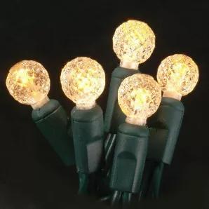 G12 Antique Candlelight LED light String with green wire, for indoor and outdoor use. Round-shaped bulb measures 1/2" in diameter. Energy Star rated, ROHS compliant. Light String has 70 lights and measures 24 feet with 4 inch spacing. 