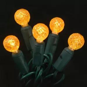 G12 Orange LED light String with green wire, for indoor and outdoor use. Round-shaped bulb measures 1/2" in diameter. Energy Star rated, ROHS compliant. Light String has 70 lights and measures 24 feet with 4 inch spacing. 