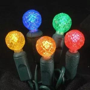 G12 Multi-Colored LED light String with green wire, for indoor and outdoor use. Round-shaped bulb measures 1/2" in diameter. Energy Star rated, ROHS compliant. Light String has 70 lights and measures 24 feet with 4 inch spacing. 