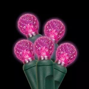 G12 Pink LED light String with green wire, for indoor and outdoor use. Round-shaped bulb measures 1/2" in diameter. Energy Star rated, ROHS compliant. Light String has 70 lights and measures 24 feet with 4 inch spacing. 